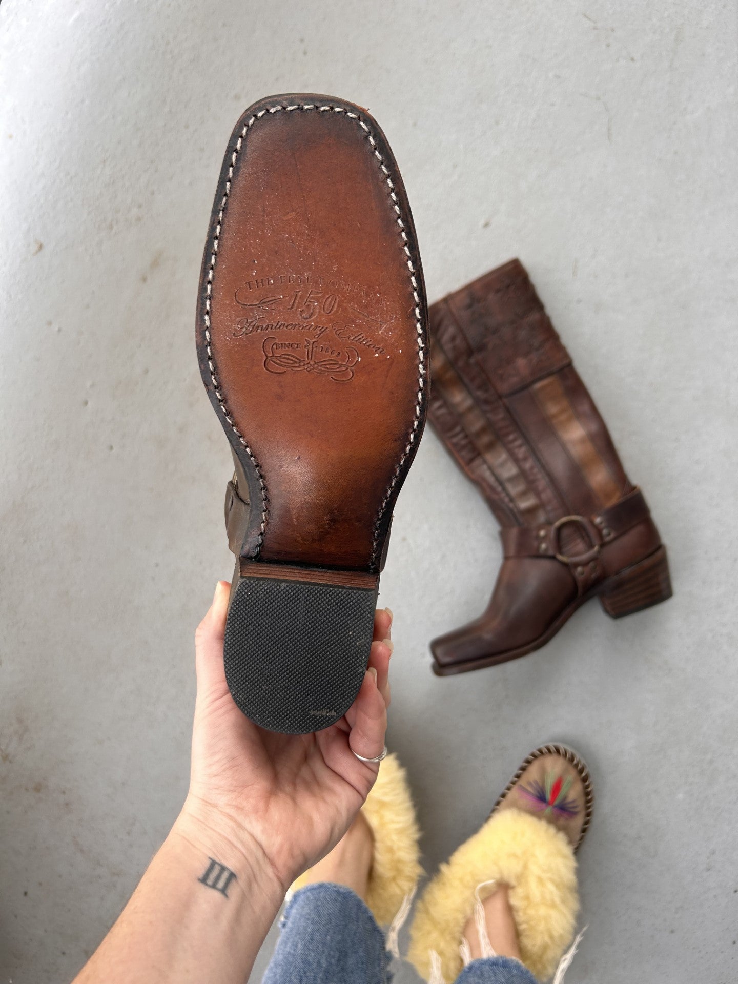 Bottom sole of Frye cowboy boots with harness