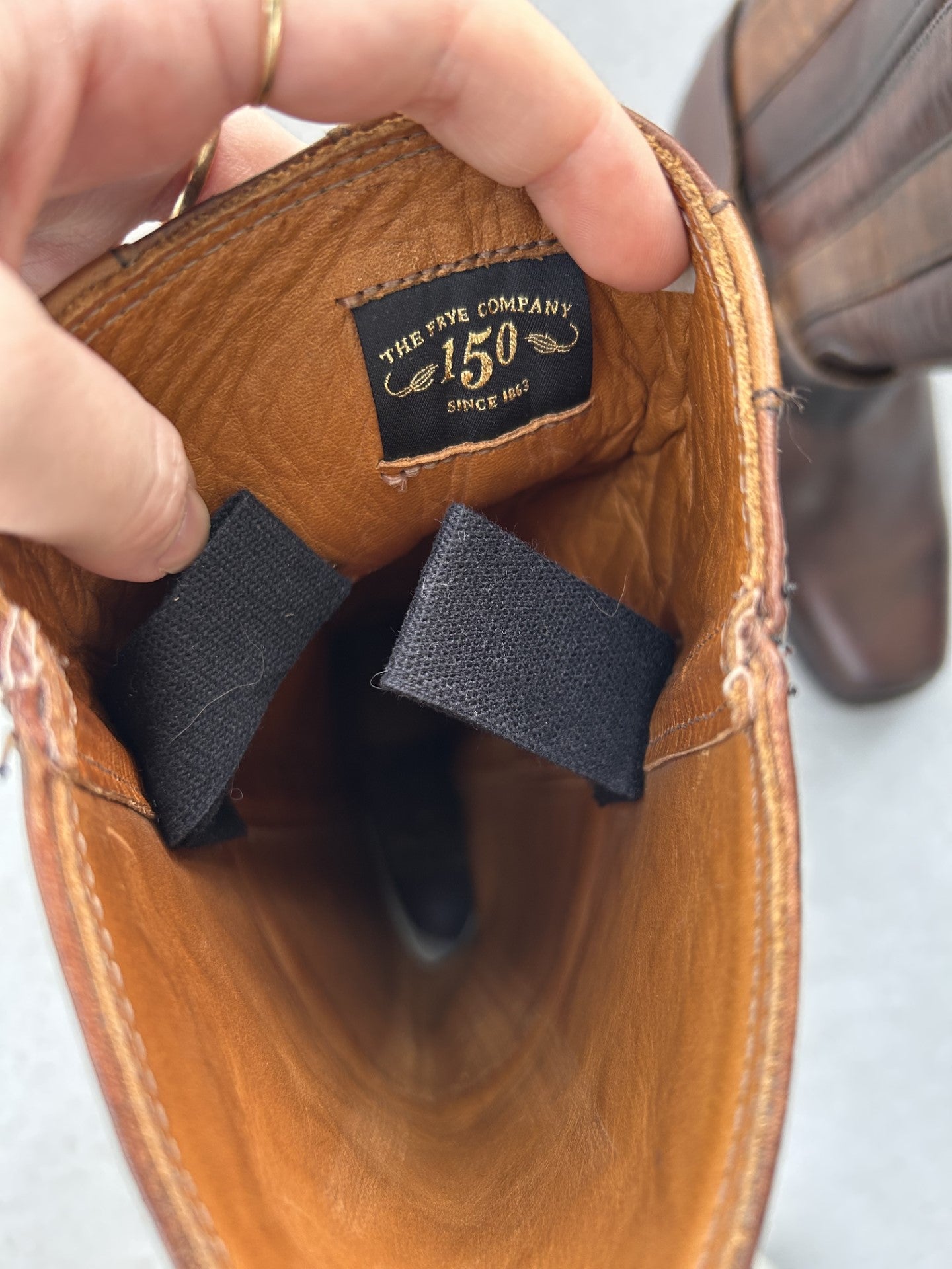 The inside of Frye cowboy boots with harness